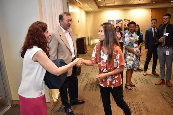 Dr. Thomas and Mrs. Salma Haider with a medical student 