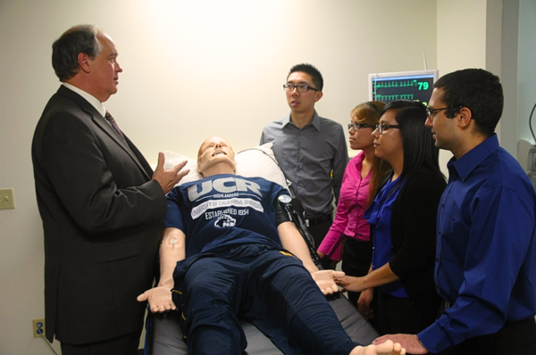 Founding Dean G. Richard Olds with medical students in the simulation lab